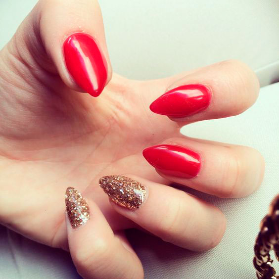 Stylish stiletto short red acrylic nails with two glitter gold shot acrylic nails!