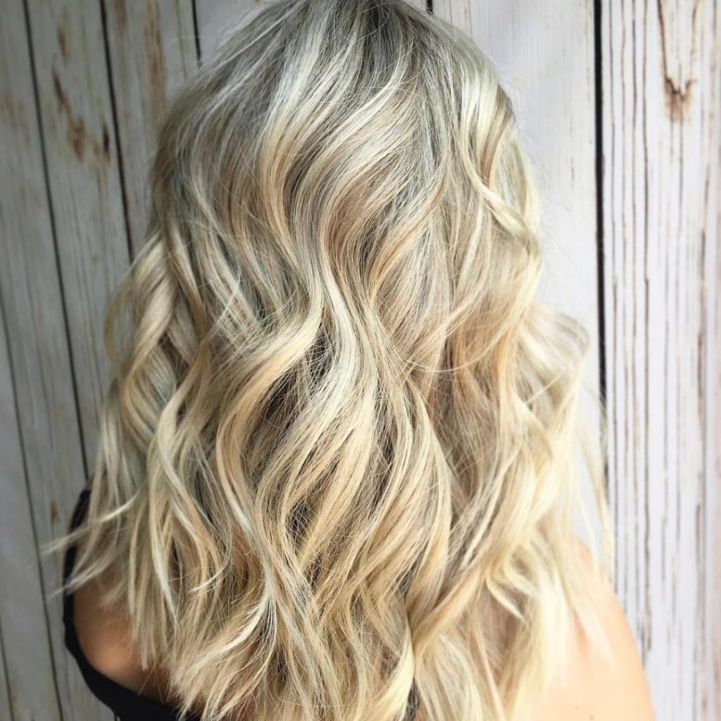 Blonde hair looks bright and shiny for a pureology's user Blonde hair looks bright and shiny for a pureology's user uses Pureology hair mask