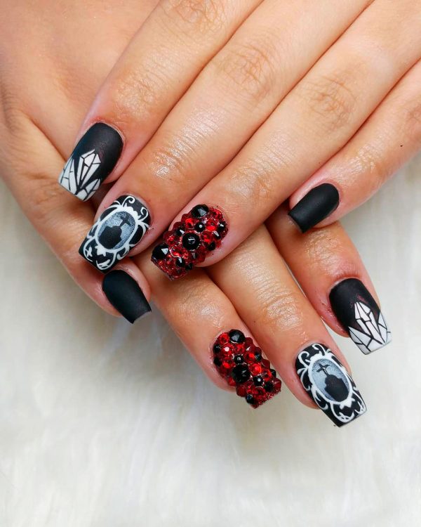 One of the Creepy black Halloween nail ideas! One of the Creepy black Halloween nail ideas, are cute short Halloween nails