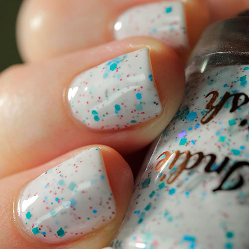 Cute white short nails with colorful flakes Cute white short nails with colorful flakes