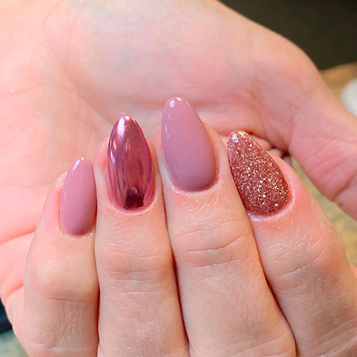 Gorgeous short nails set between nude, glitter, and rose gold chrome almond nails