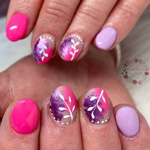 Pink and purple short acrylic nails with white leaf nail art is a beautiful and feminine nail design 