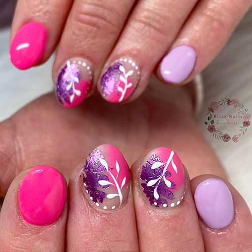 Pink and purple short acrylic nails with white leaf nail art is a beautiful and feminine nail design Pink and purple short acrylic nails with white leaf nail art is a beautiful and feminine nail design