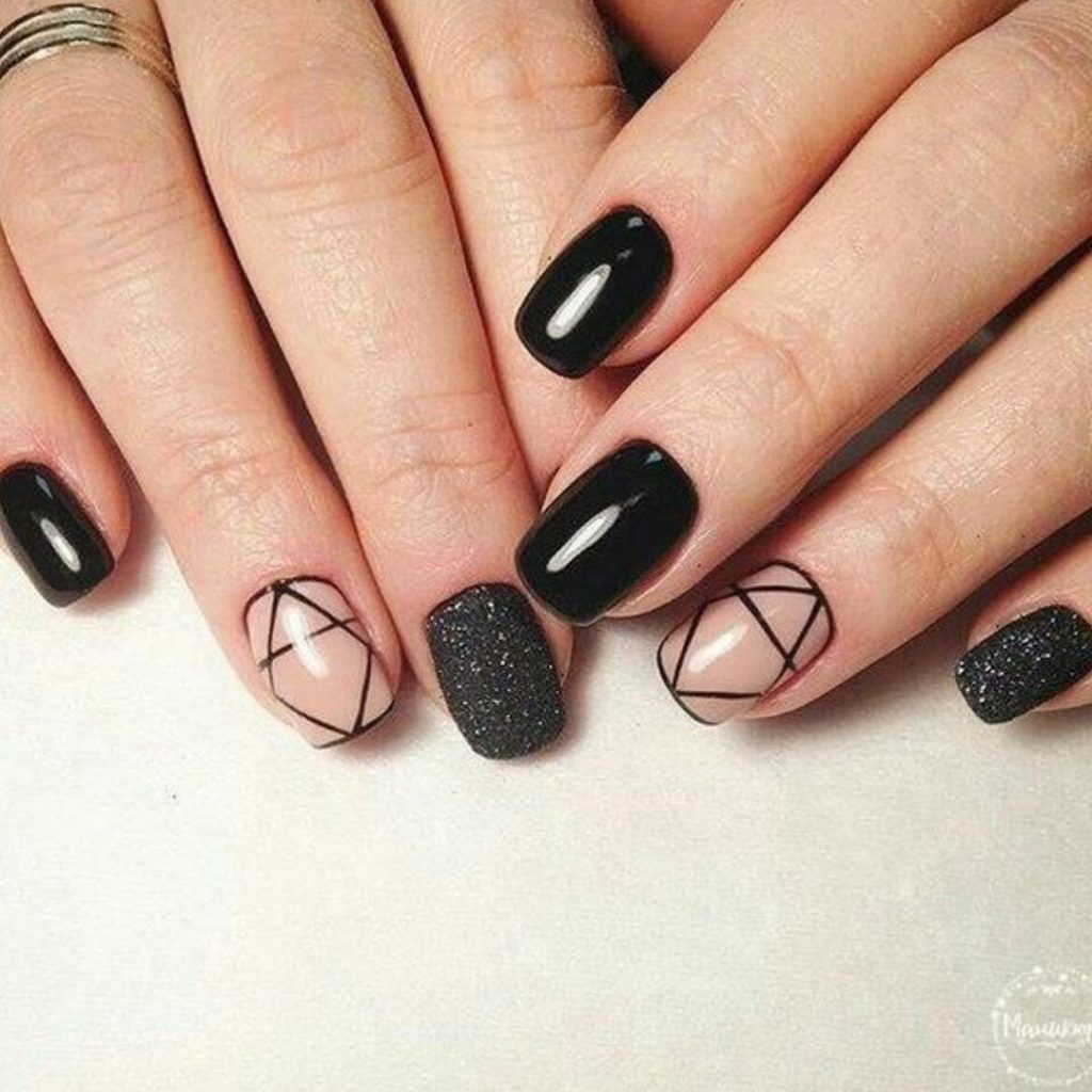 Stunning black short acrylic nails design with nude and glitter nails!