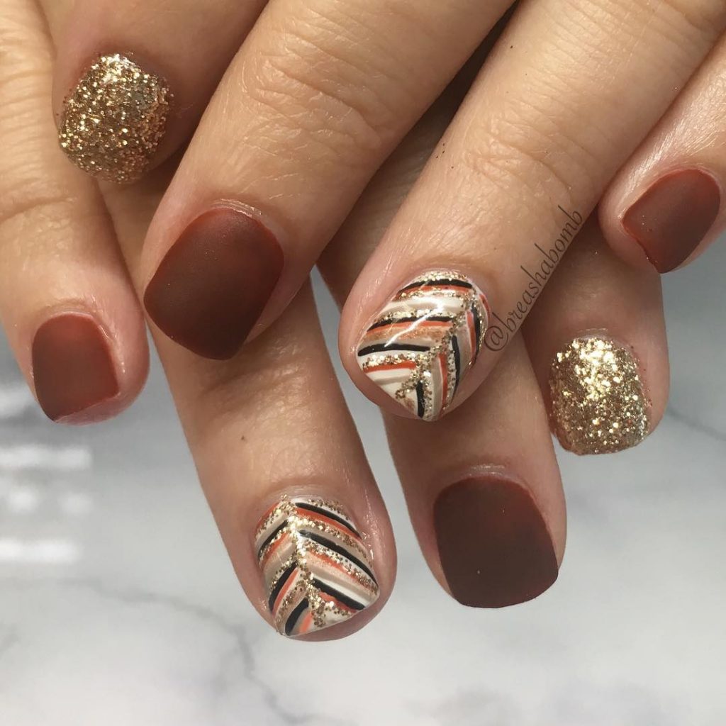 Cute Short Thanksgiving Nails with Gold Glitter and Leaf Accent nail design