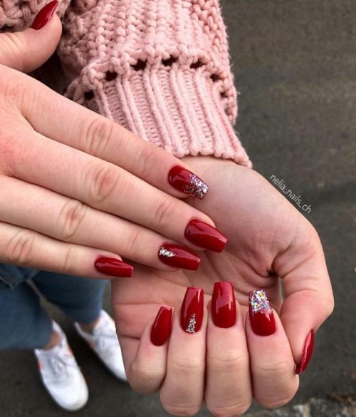 Amazing dark red Christmas gel nails with glitter and rhinestones!