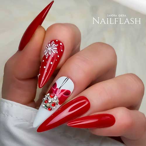 Amazing red Christmas stiletto nails set with rhinestones and an accent snowflake nail!