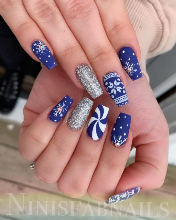 Cute blue snowflake Christmas themed nails with an accent silver glitter nail!