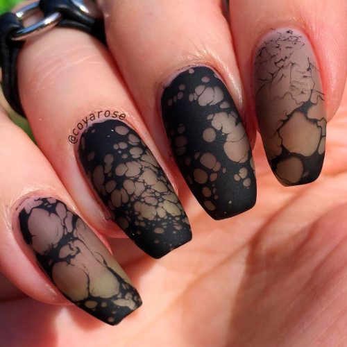 Amazing Sheer black and water spotting nail art design looks like black marble nails!