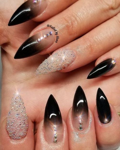 Gorgeous stiletto black ombre nails with an accent glitter nail!
