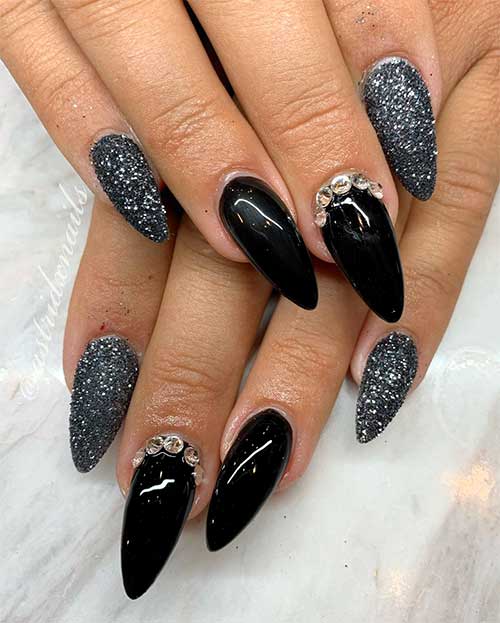Beautiful black almond nails with rhinestones and silver glitter nails design!