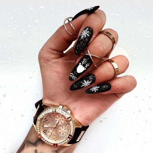 Silver and black nails 29 Beautiful long almond black nails with glitter, snowflakes, and an accent reindeer nail!