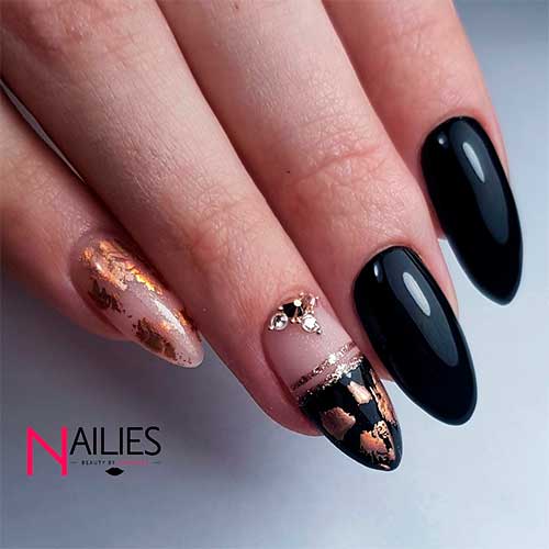 Black almond nails wit gold foil nails design!