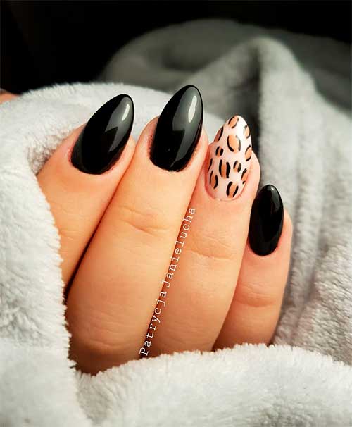 Cute black almond nails set with an accent leopard nail!