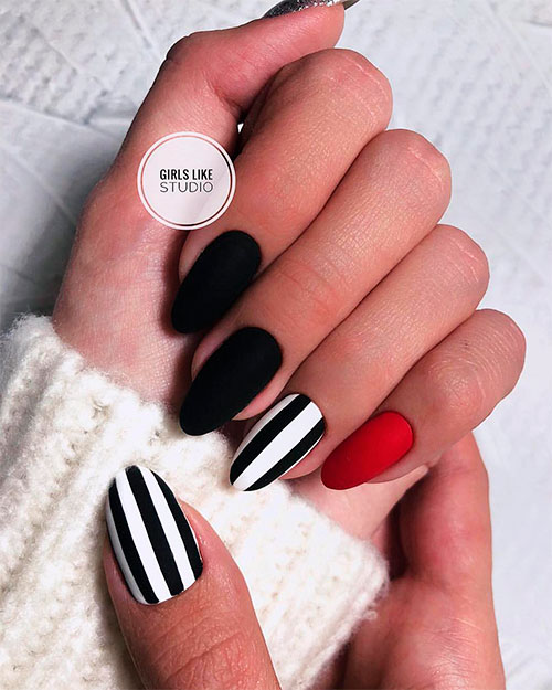 Cute black and white nails with an accent red nail!