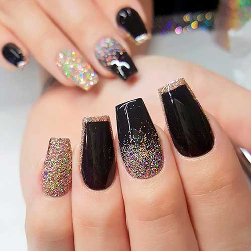 Cute coffin shaped black nails with gold glitter tips with gold glitter accent nail design