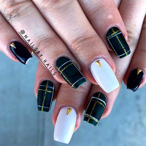 Cute plaid nails black and white with gold glitter and an accent white nail adorned with gold rhinestone!