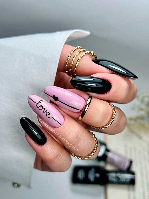 Long glossy black nails 2023 with nude pink accent nails adorned with love letters to celebrate Valentine's Day