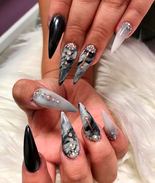 Gorgeous stiletto black and gray marble nails!