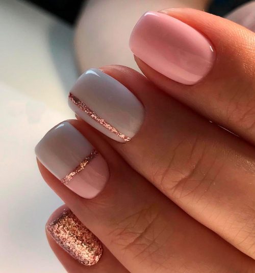 Cute pink and grey short nails with gold glitter