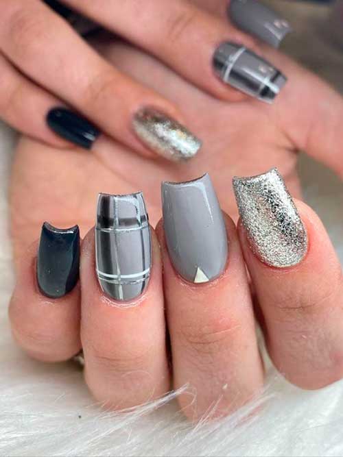 Amazing gray and black nails with silver glitter nail!