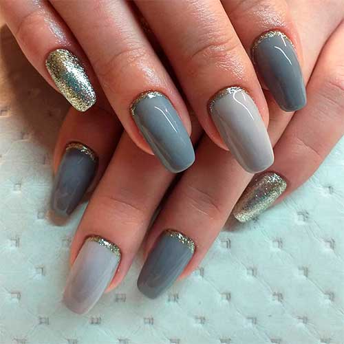 Coffin shaped gray nails with gold glitter in different gray shades