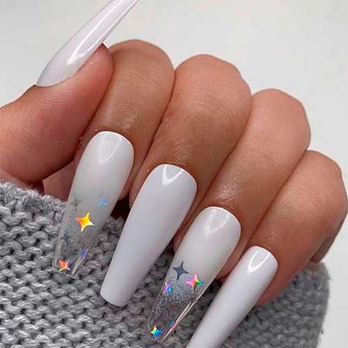Cute light gray coffin nails design adorned with foil stars! Cute light gray coffin nails design adorned with foil stars!