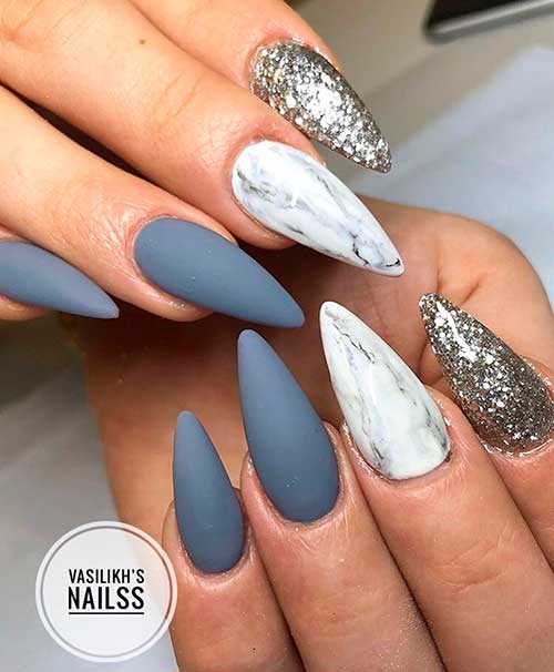 Cute matte gray almond nails with two accent marble and glitter nails design! Cute matte gray almond nails with two accent marble and glitter nails design!