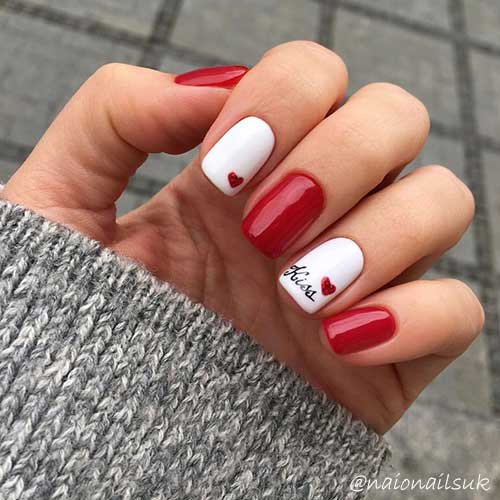 Red short acrylic valentines nails with kiss word and red heart on white short nails