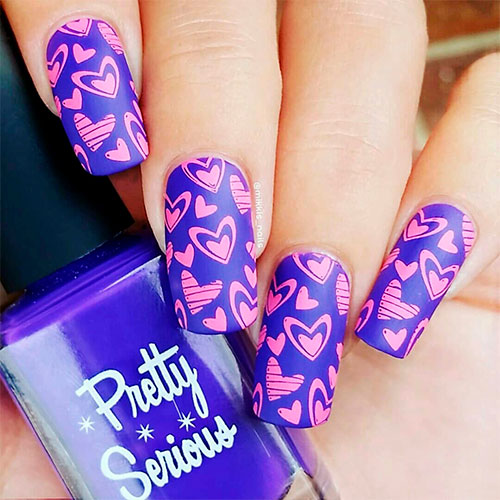 Gorgeous pink hearts over valentines purple nails!