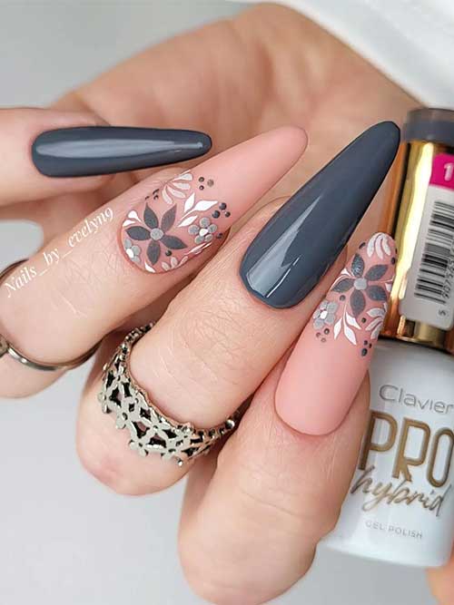 Long almond-shaped dark gray spring nails 2023 with floral nail art on two accent nails