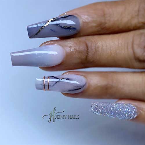 Marble grey nails with gold glitter and two accent grey nails with glitter and grey ombre nail