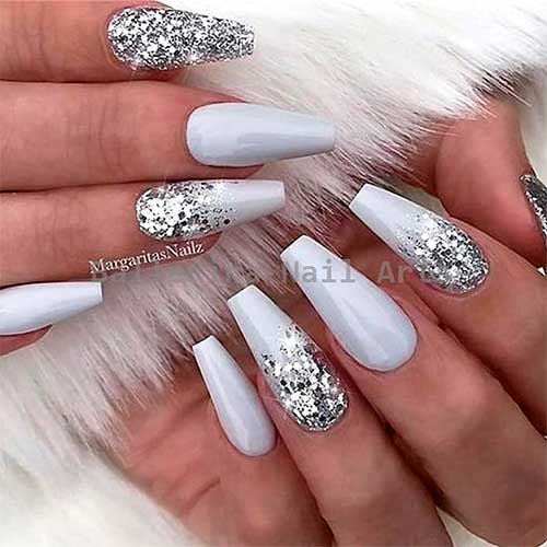 Pretty light coffin shaped grey nails set with sliver glitter!