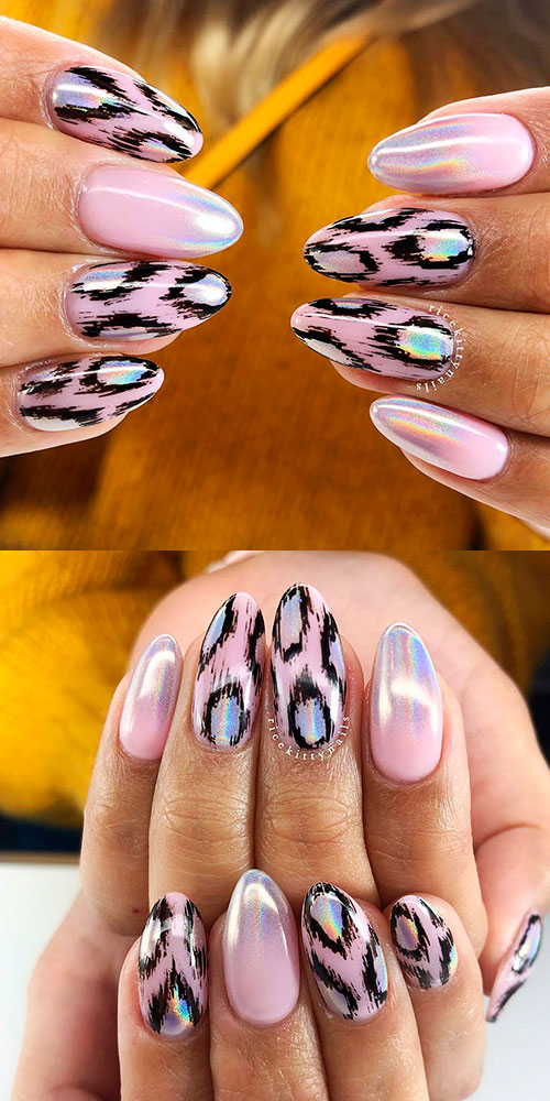 Amazing pink leopard nails design that uses baby pink as a base coat and printed black leopard pattern with holographic tips and leopard pattern.