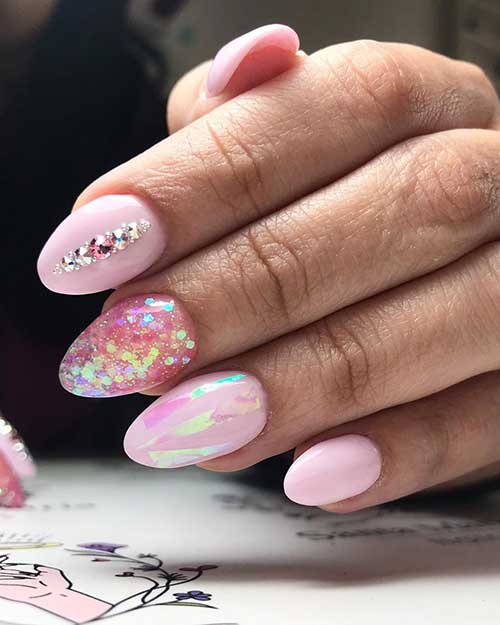 Cute baby pink almond nails set adorned with an accent glitter nail & rhinestones!