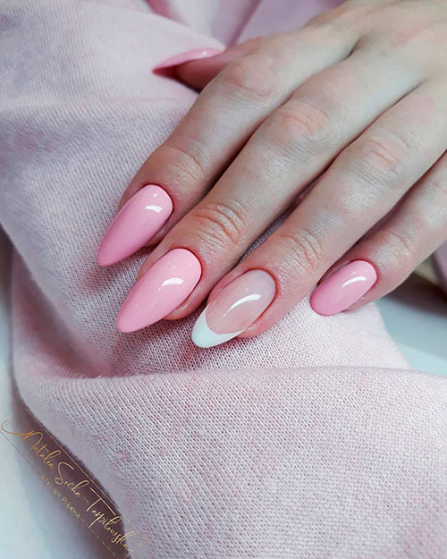 Cute baby pink almond nails with an accent classic French nails