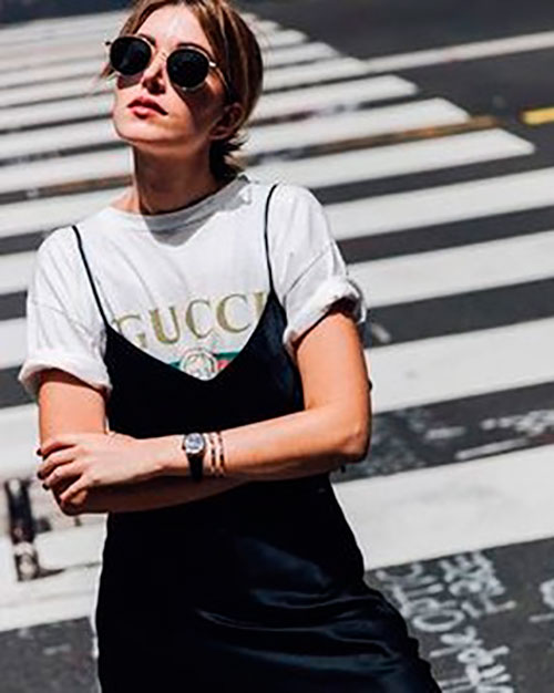 Black silk slip dress layered over a white Gucci t-shirt for spring outfits 2019