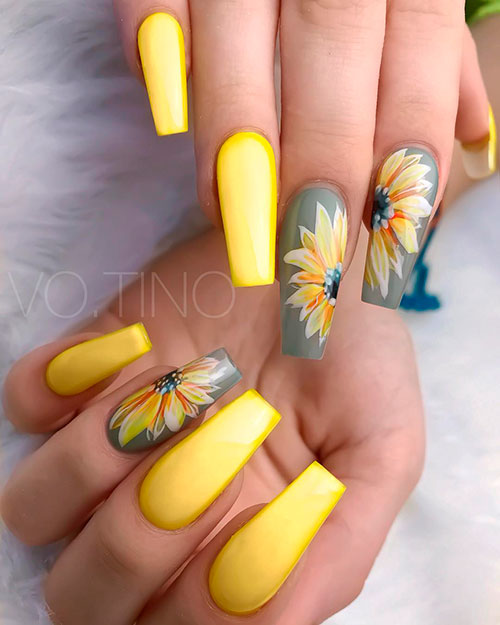Cute ultra bright yellow coffin nail and coffin grey nails with a sunflower