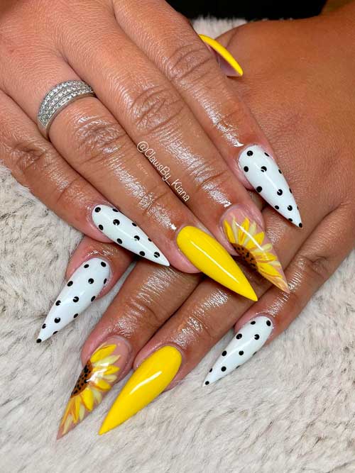 Long Stiletto yellow and white nails with black dots and sunflower on accent nails