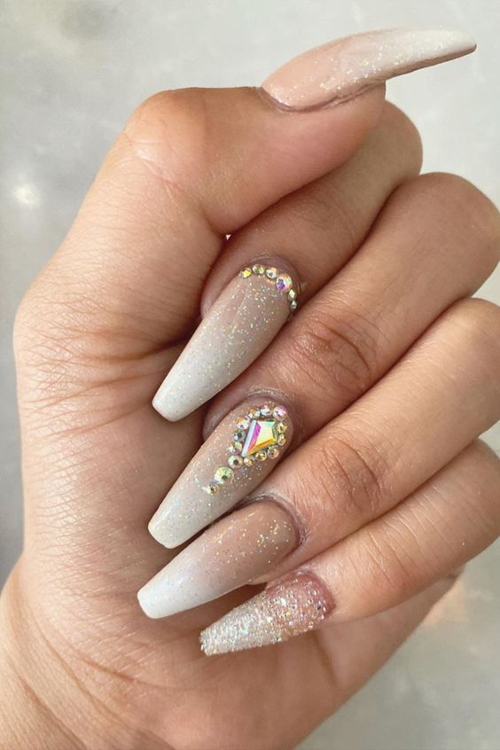 Cute coffin shaped French ombre nails with glitter and rhinestones!