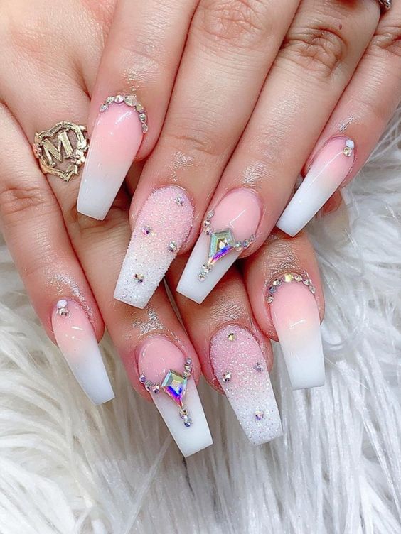 Cute white pink ombre coffin nails with white sugar glitter on accent nail and rhinestones.