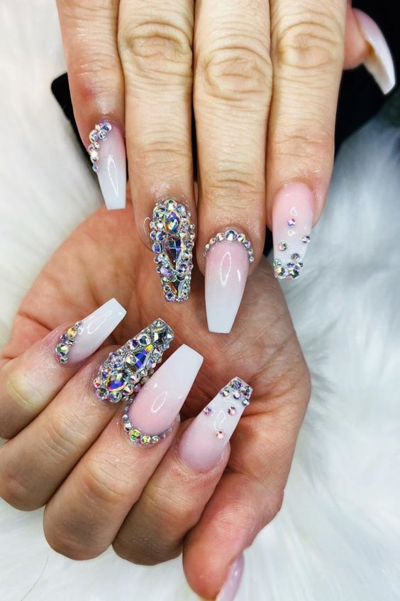 Coffin French ombre nails with blue ornaments design. Coffin French ombre nails with blue ornaments design.