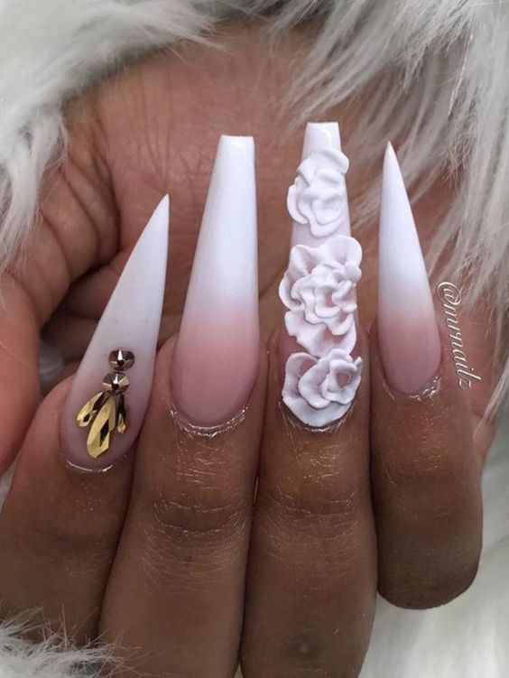 Cute French ombre nails coffin and stiletto nails mixed with 3d flower and gold rhinestones.