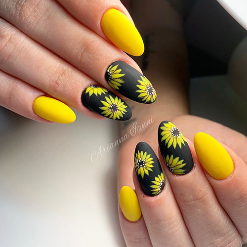 Cute almond yellow nails with a sunflower on black nails for summer 2019