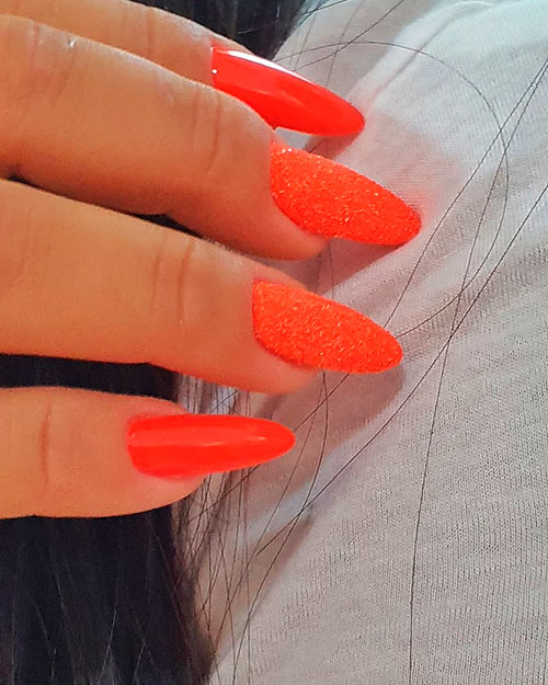 Cute neon orange nails with glitter for an awesome look in 2019