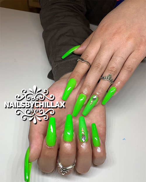 Long coffin shaped slime green nails adorned with crystals on ring fingernail for summer 2019 