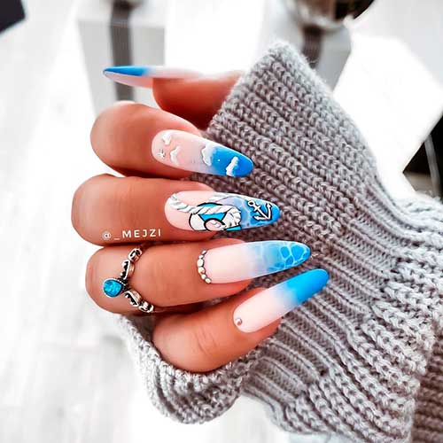 Cute baby blue ombre nails almond shaped with sea water and sky clouds theme!