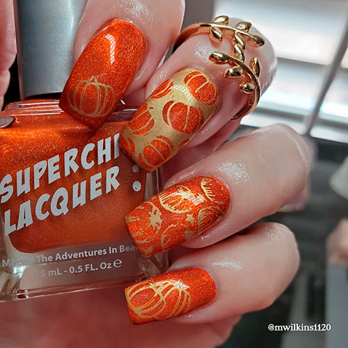 Cute fall nails consists of shimmer orange pumpkin nails for autumn season