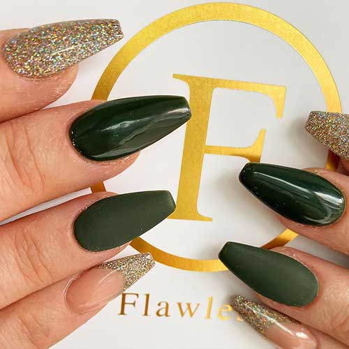 Amazing coffin shaped dark green nails with gold glitter accent nail and gold French tip nail!