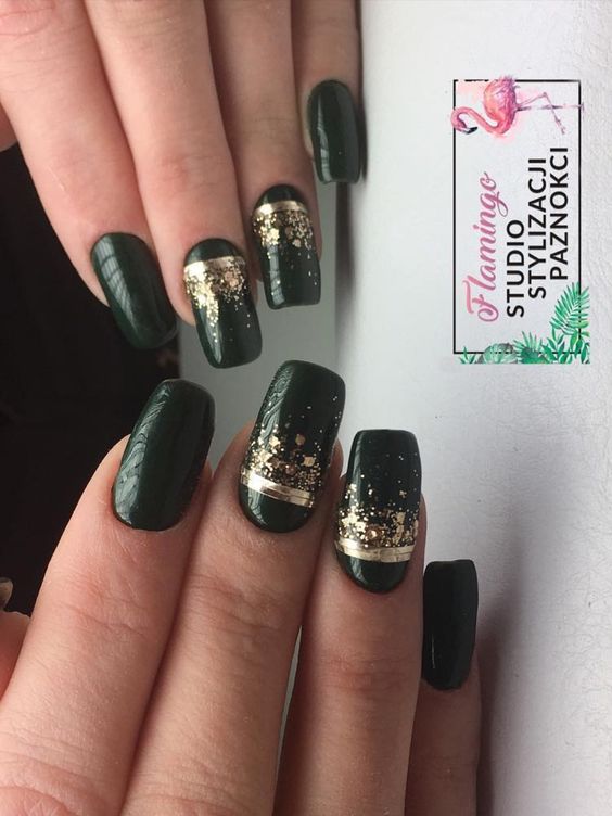 Amazing dark green nails with gold glitter & foil strips!